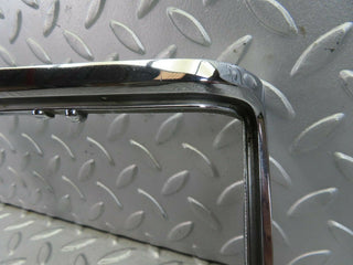 W115 tail light chrome frame left side used OEM