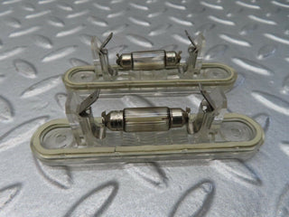 W124 number plate light pair used OEM