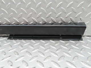 W123 front left cable channel cover used OEM