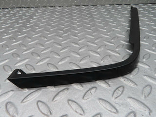 R129 SL right headlight lower trim used OEM