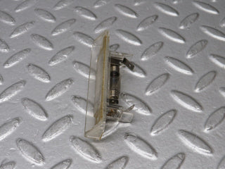 R129 SL number plate light used OEM