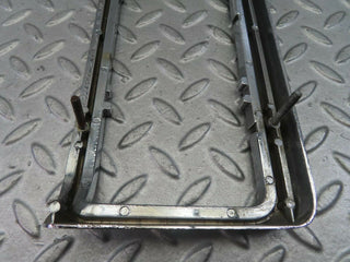 W115 tail light chrome frame left used OEM