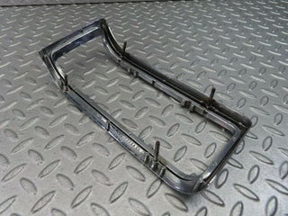 W115 tail light chrome frame left used OEM