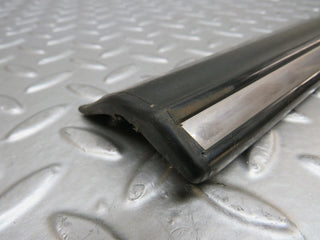 W123 front left door lower moulding trim used OEM