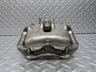 W124 Wagon front left brake caliper used OEM