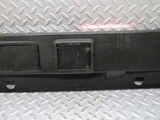 W124 trunk lock trim panel used OEM