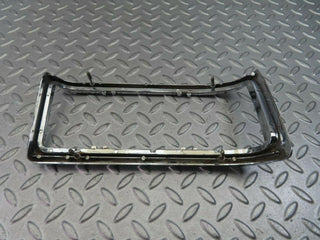 W115 tail light chrome frame left used OEM