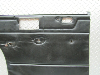 W115 rear left door card black used OEM