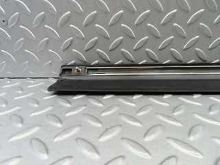 W123 front left door lower trim used OEM