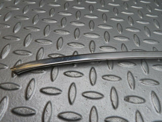 W123 rear right door window chrome frame used OEM