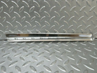 R107 SLC rear right window chrome used OEM