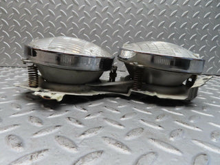 W111 headlight left/right used OEM