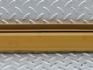 W123 rear left door sill trim palomino used OEM