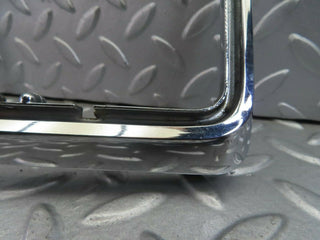 W115 tail light chrome frame left side used OEM