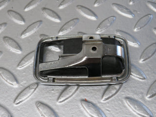 W123 chrome frame for door opener left used OEM