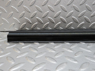 W123 front left door sill trim black used OEM
