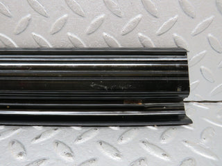 W123 rear right door sill trim black used OEM