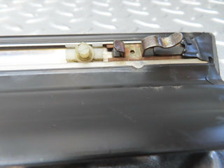 W123 front left door lower trim used OEM