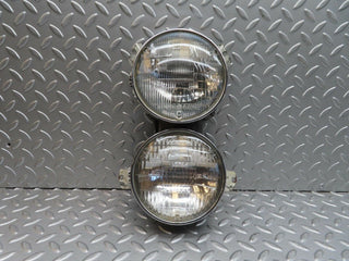 W111 headlight left/right used OEM