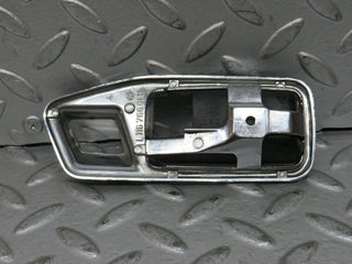W123 chrome frame for door opener left used OEM