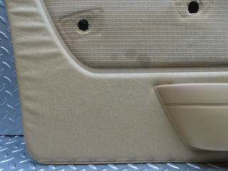 W123 front left door card beige used OEM