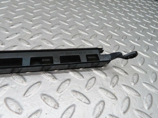 W140 headlight lower trim left side used OEM